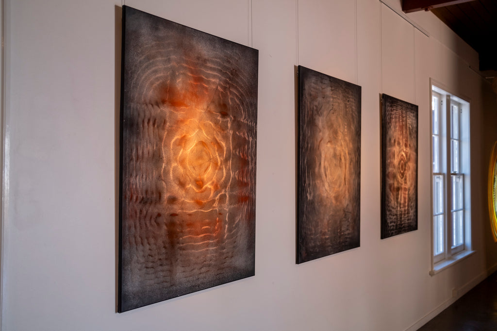 Large original cymatics chladni painting displayed in gallery — sound vibration art with earth pigments on canvas