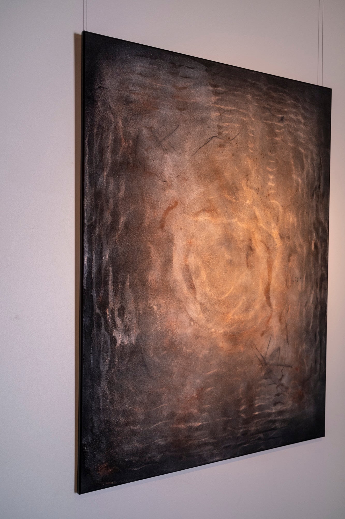 Large original cymatics painting displayed in gallery — sound vibration art with earth pigments on canvas